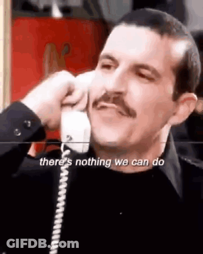 Man With Mustache Talking On Phone Says There's Nothing We Can Do GIF