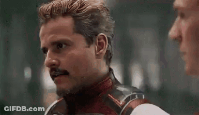 Man With Mustache Talking To Another Man GIF