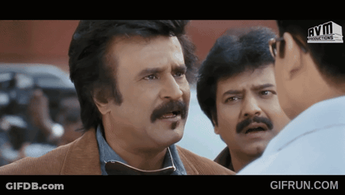 Man With Mustache Talking To Another Man GIF