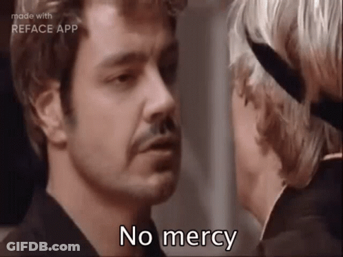 Man With Mustache Talking To Woman With Knife GIF
