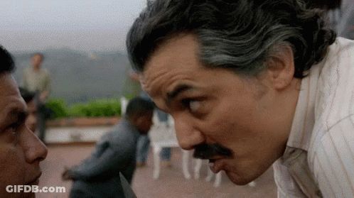 Man With Mustache Watching Knife Man GIF
