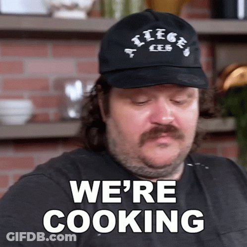 Man With Mustache Wearing Hat Saying We're Cooking GIF