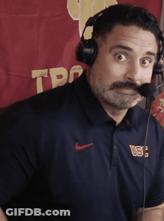 Man With Mustache Wearing Headphones And USC Shirt GIF