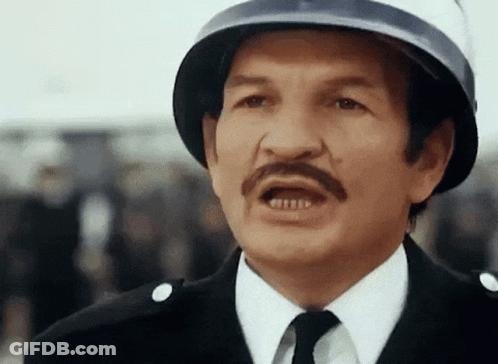 Man With Mustache Wearing Helmet Making Funny Face GIF