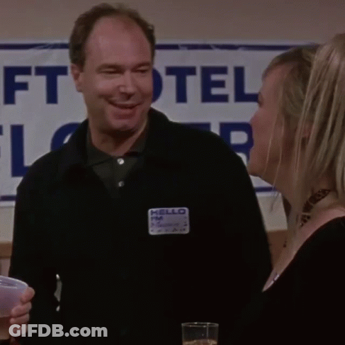Man With Name Tag Saying Hello FM GIF