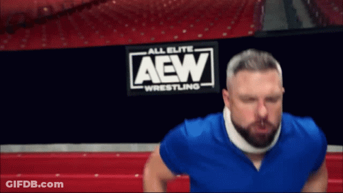 Man With Neck Brace In Front Of AEW Wrestling Sign GIF