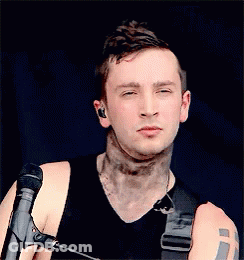 Man With Neck Tattoo And Eyes Closed At Microphone GIF