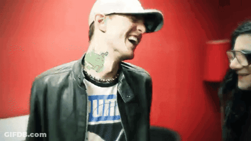 Man With Neck Tattoo Laughing In Puma Shirt GIF