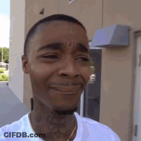 Man With Neck Tattoo Making Sad Face GIF