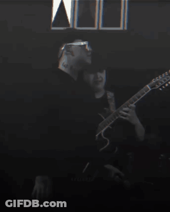 Man With Neck Tattoo Playing Guitar GIF
