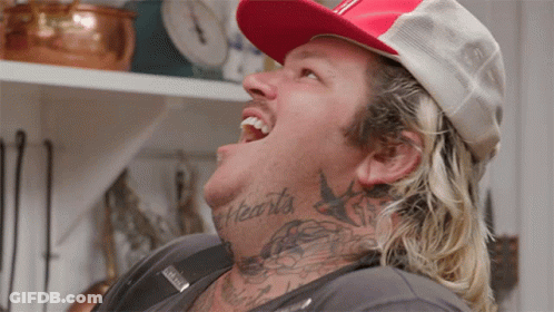 Man With Neck Tattoo Reading Hearts GIF