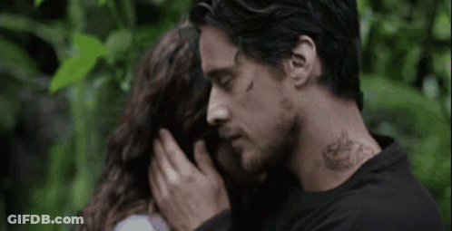 Man With Neck Tattoo Touching Woman's Forehead GIF