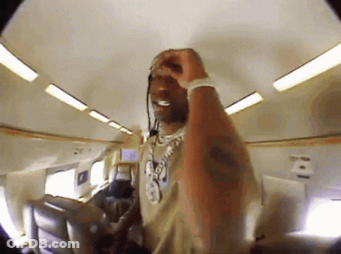 Man With Necklace And Bracelet On Plane GIF