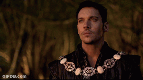 Man With Necklace Looking Up GIF