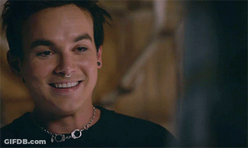 Man With Nose Ring And Necklace Smiling GIF