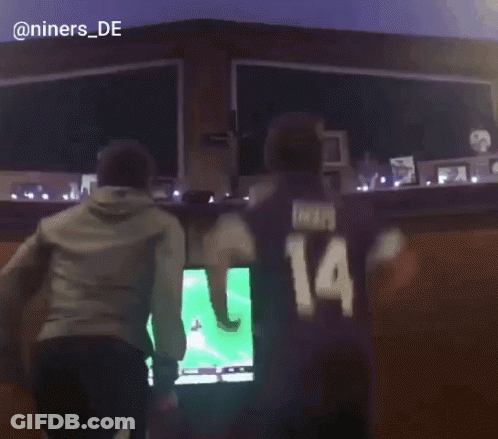 Man With Number 14 On Back Before Television GIF