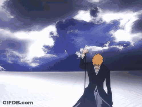 Man With Orange Hair Standing In Front Of Cloudy Blue Sky GIF