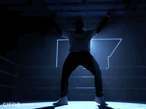 Man With Outstretched Arms In Boxing Ring GIF