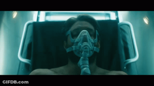 Man With Oxygen Mask Laying In Bed GIF
