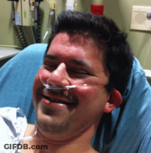 Man With Oxygen Tube Smiling In Hospital Bed GIF