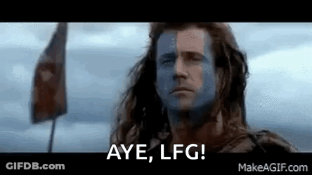 Man With Paint On Face Standing In Front Of Flag GIF