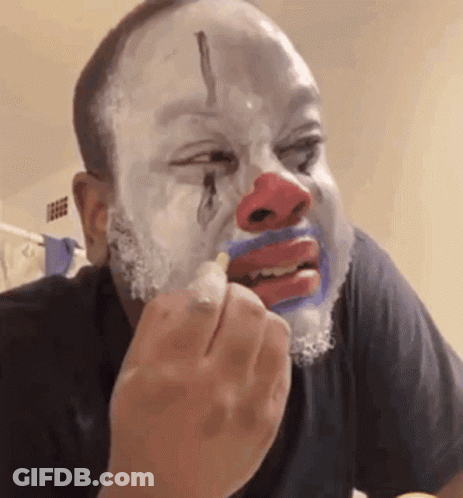 Man With Painted Clown Face Eating GIF