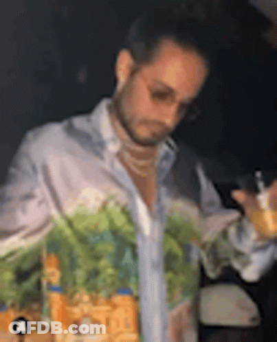 Man With Painted Shirt Holding Wine GIF
