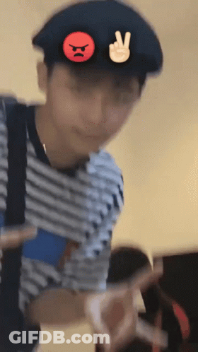 Man With Peace Sign Hat And Angry Face GIF