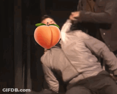 Man With Peach Face Being Attacked GIF