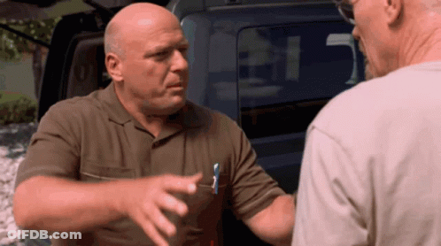 Man With Pen In Pocket Talks To Another Man In Front Of Car GIF