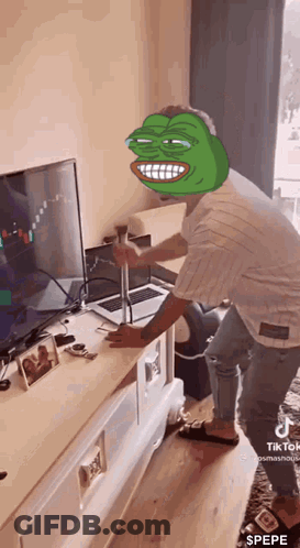 Man With Pepe The Frog Face In Front Of Laptop GIF