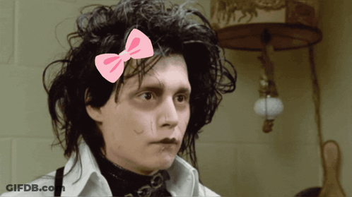 Man With Pink Bow In Hair GIF