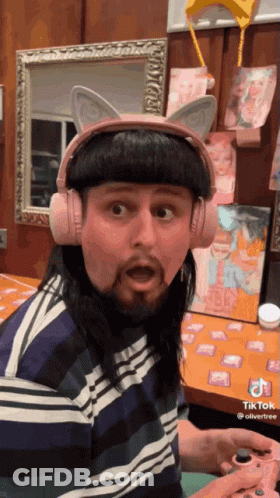 Man With Pink Cat Ear Headphones Playing Game GIF