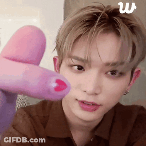 Man With Pink Finger On Face GIF