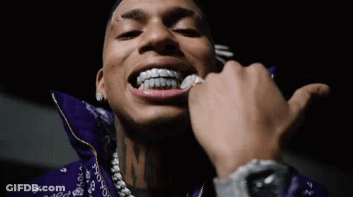Man With Pink Hair And Braces Smiling In Car GIF