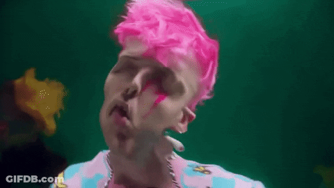 Man With Pink Hair And Earrings In Pink And Blue Shirt GIF