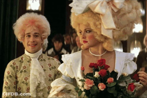 Man With Pink Hair And Woman With Red Roses GIF