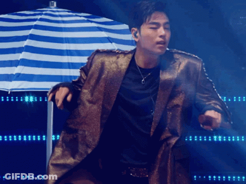 Man With Pink Hair Singing Into Microphone In Black Jacket And Choker GIF