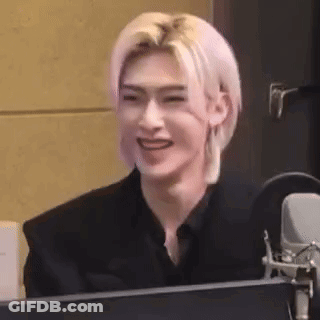 Man With Pink Hair Smiling At Microphone GIF