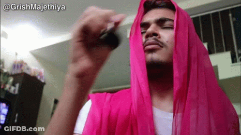Man With Pink Scarf Holding Key GIF