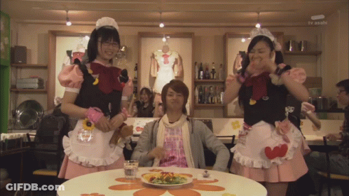 Man With Plate Of Food And Maids Behind GIF