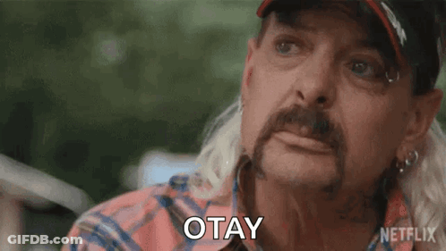 Man With Ponytail And Hat Saying Okay GIF