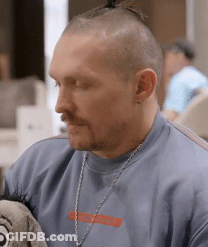 Man With Ponytail And Hermes Necklace GIF