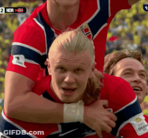 Man With Ponytail In Blue Sky Shirt GIF