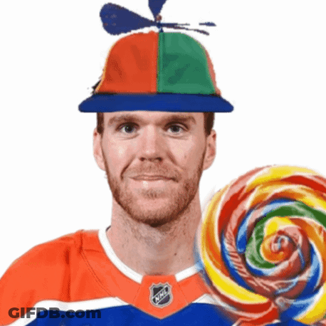 Man With Propeller Hat Holding Lollipop GIF