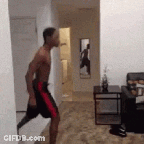 Man With Prosthetic Leg Walking Through Hallway GIF