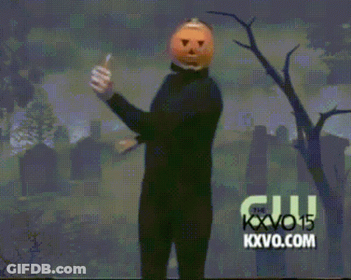 Man With Pumpkin Head Dancing In Cemetery Sponsored By KXVO15 GIF