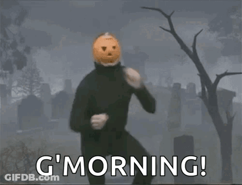 Man With Pumpkin Head In Cemetery Says G Morning GIF
