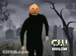 Man With Pumpkin Head In Cemetery GIF