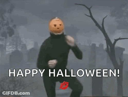 Man With Pumpkin Head Running In Cemetery Says Happy Halloween GIF